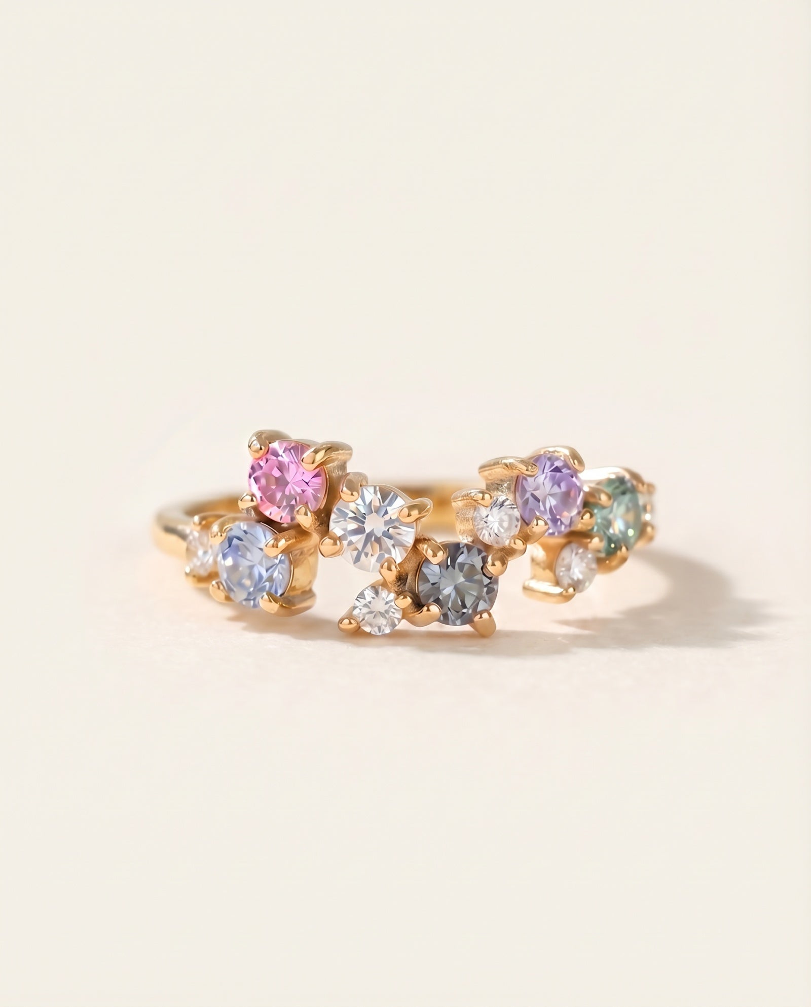 Top view of Painter’s Palette Ring in 18k Yellow Gold featuring a whimsical cluster of pastel-hued moissanites.