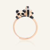 Close-up of the Panda Sushi Roll Ring (Opal) in rose gold, resting on a warm linen background