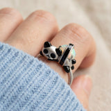 Panda Sushi Roll Ring (Opal) in silver, worn on a model