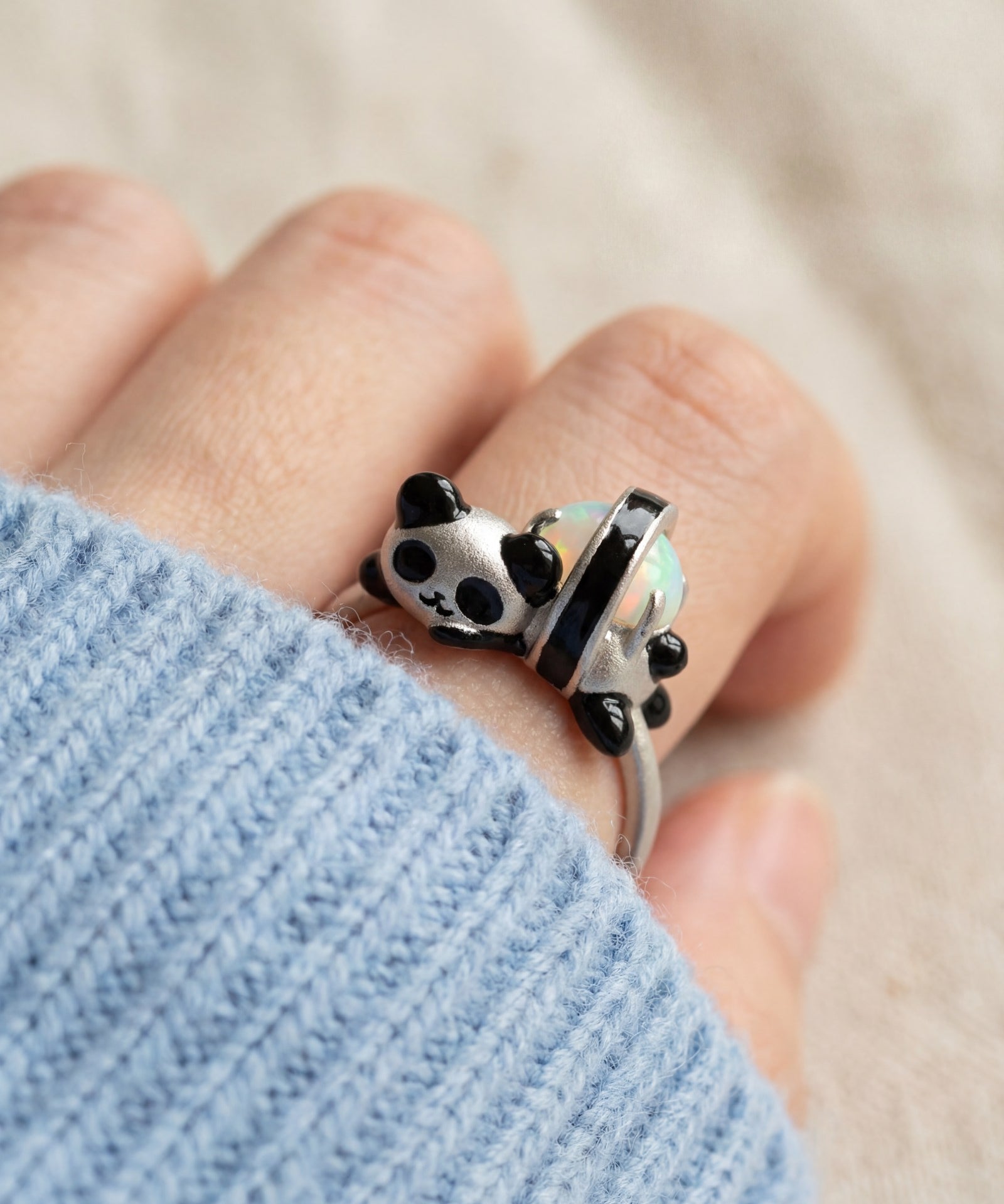 Panda Sushi Roll Ring (Opal) in silver, worn on a model