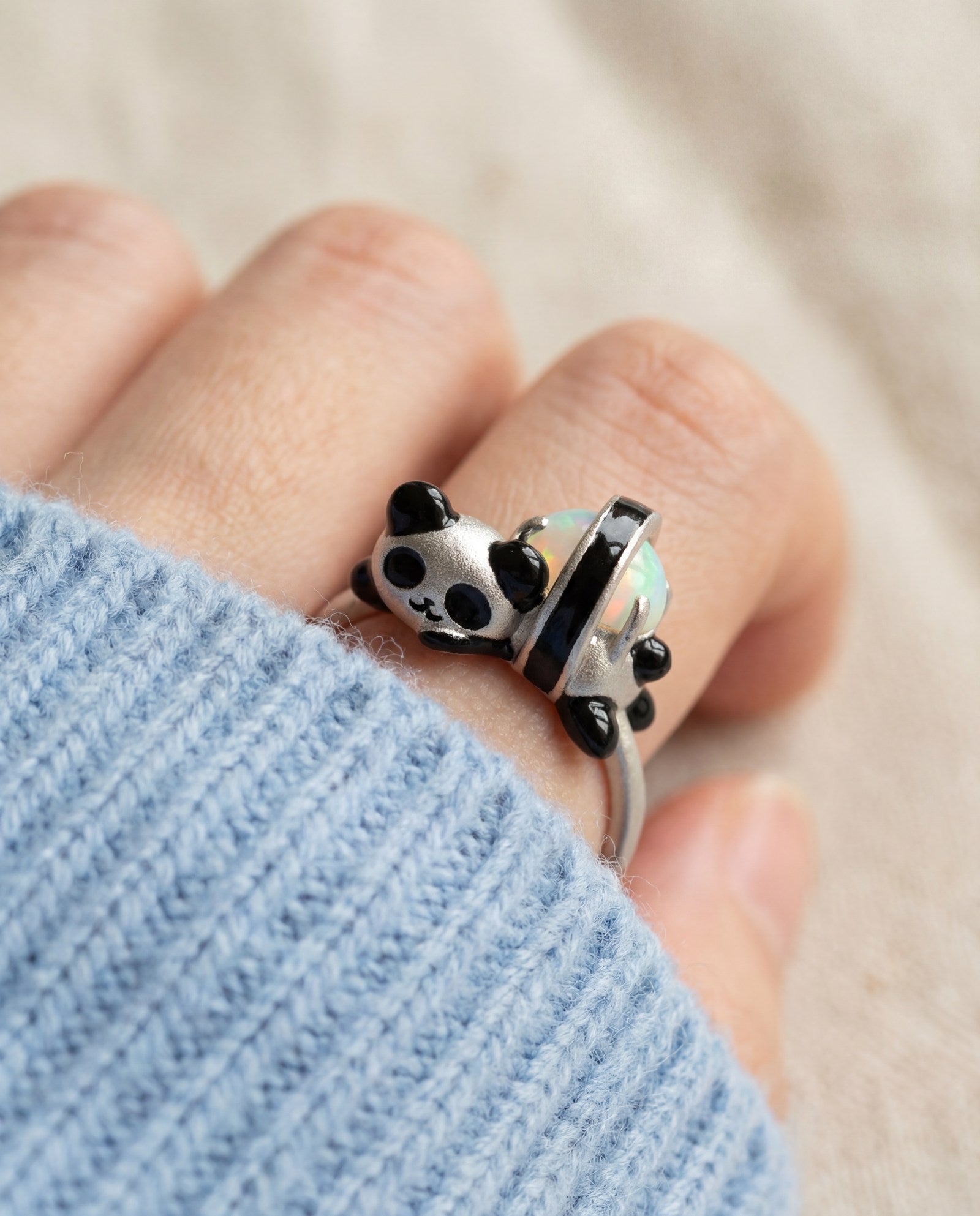Panda Sushi Roll Ring (Opal) in silver, worn on a model