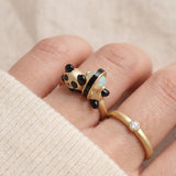 Panda Sushi Roll Ring (Opal) in yellow gold, worn on a model