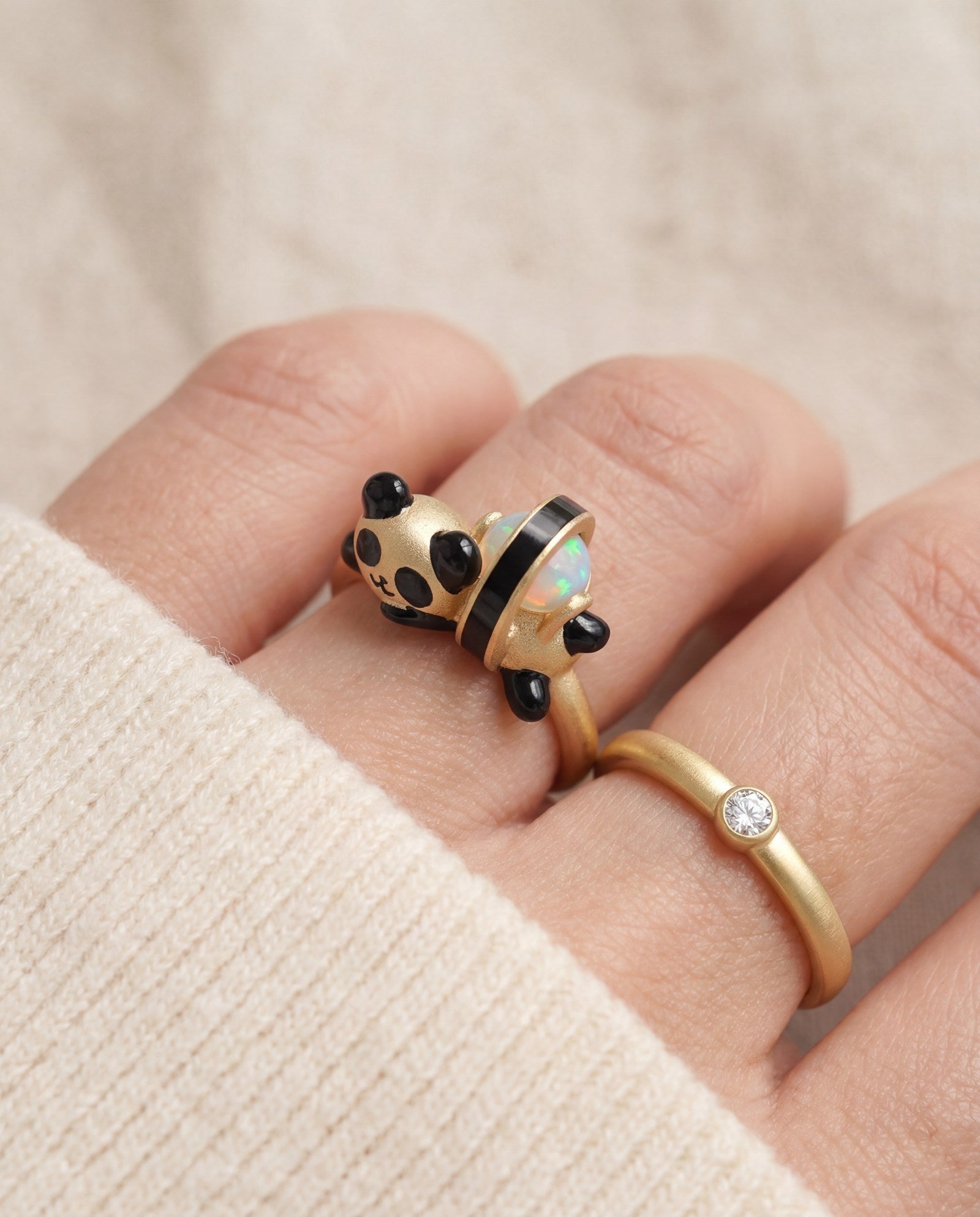 Panda Sushi Roll Ring (Opal) in yellow gold, worn on a model