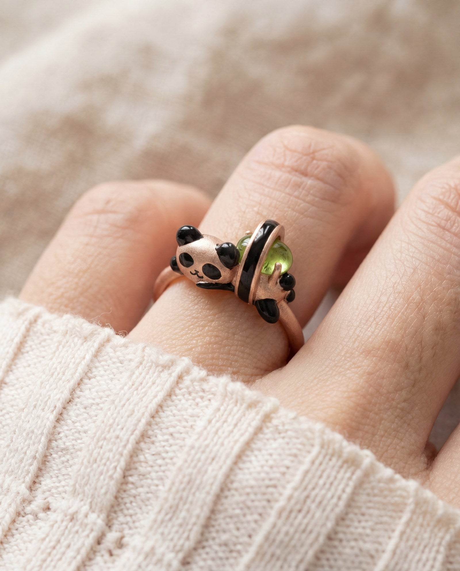 Panda Sushi Roll Ring (Peridot) in rose gold, worn on a model