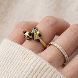 Panda Sushi Roll Ring (Peridot) in yellow gold, worn on a model