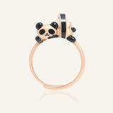 Close-up of the Panda Sushi Roll Ring (White Jade) in rose gold, resting on a warm linen background