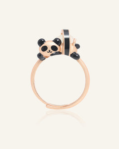 Close-up of the Panda Sushi Roll Ring (White Jade) in rose gold, resting on a warm linen background
