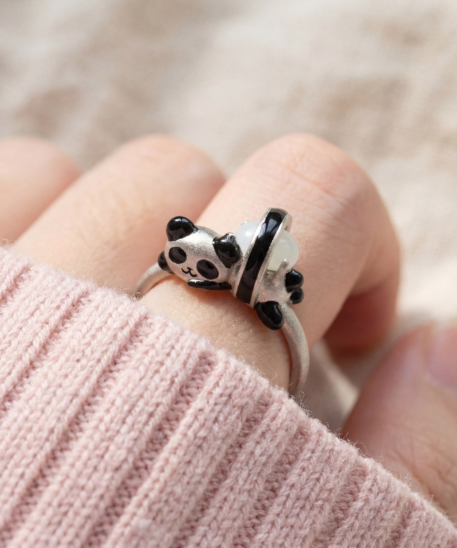 Panda Sushi Roll Ring (White Jade) in silver, worn on a model