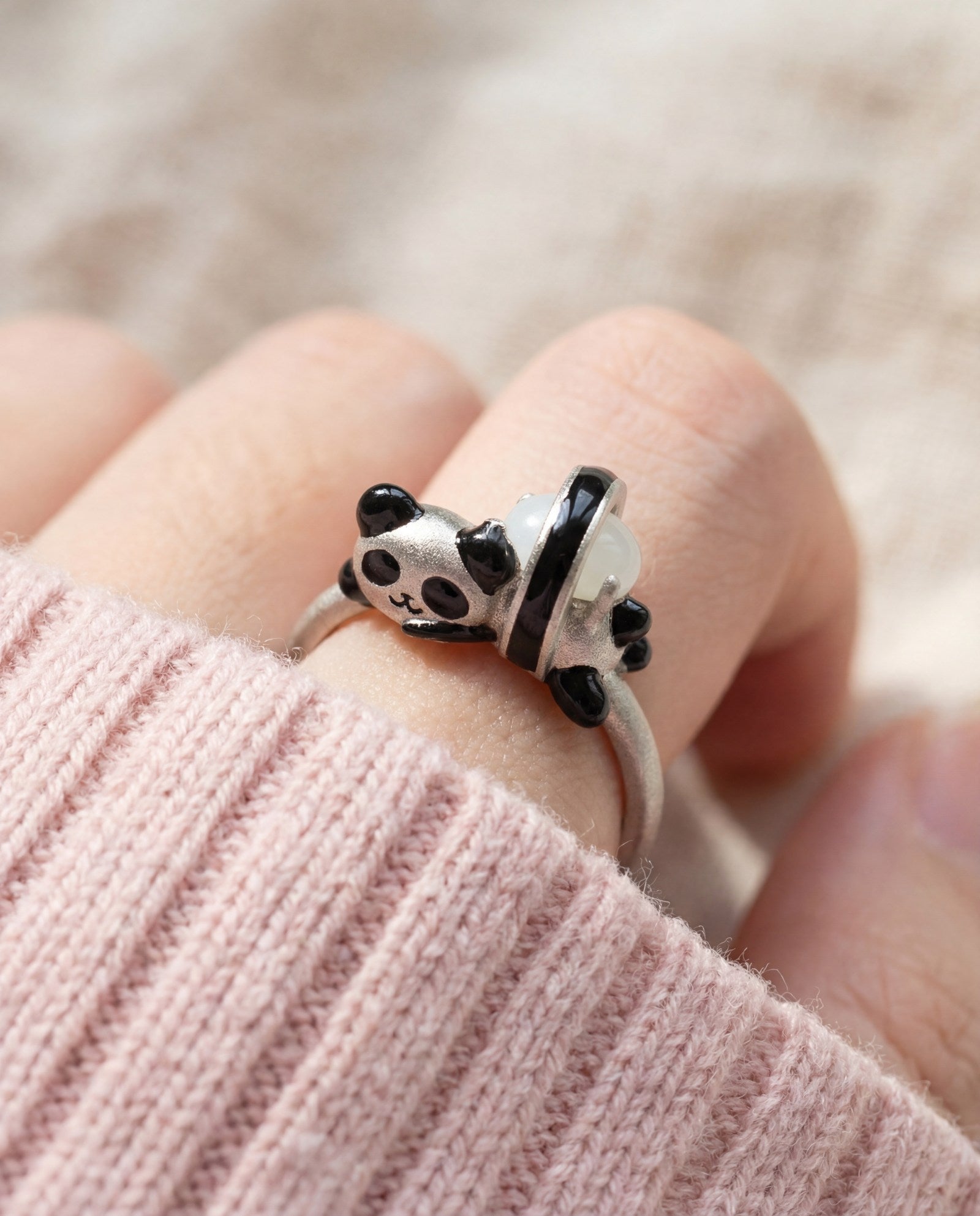 Panda Sushi Roll Ring (White Jade) in silver, worn on a model