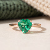 Paraiba Topaz Heart Ring | XL in rose gold, laid flat on a tabletop