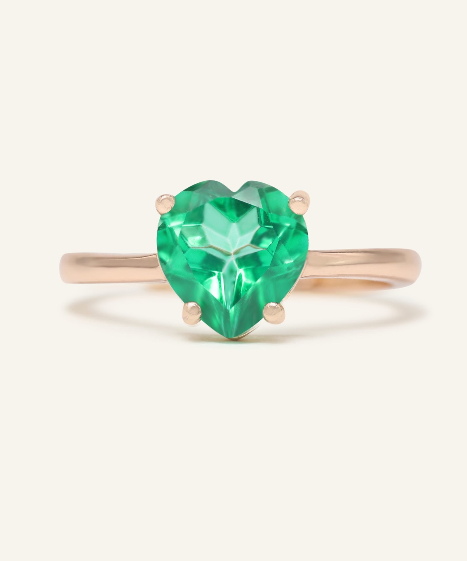Paraiba Topaz Heart Ring | XL in rose gold, resting on a warm linen background