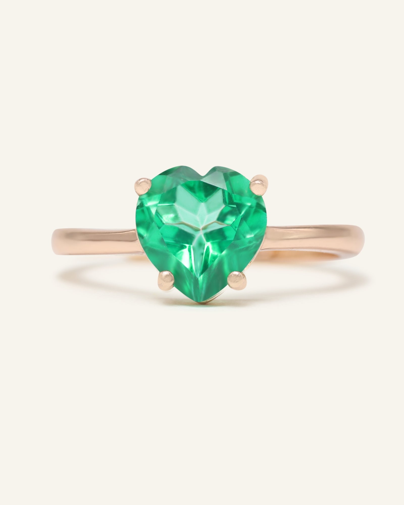 Paraiba Topaz Heart Ring | XL in rose gold, resting on a warm linen background