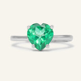 Paraiba Topaz Heart Ring | XL in silver, resting on a warm linen background