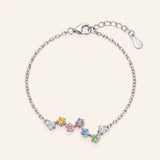A top-down studio product photograph of the Pastel Constellation Moissanite Bracelet in silver, displaying the organic constellation layout of soft pastel moissanite stones on a crisp white background.