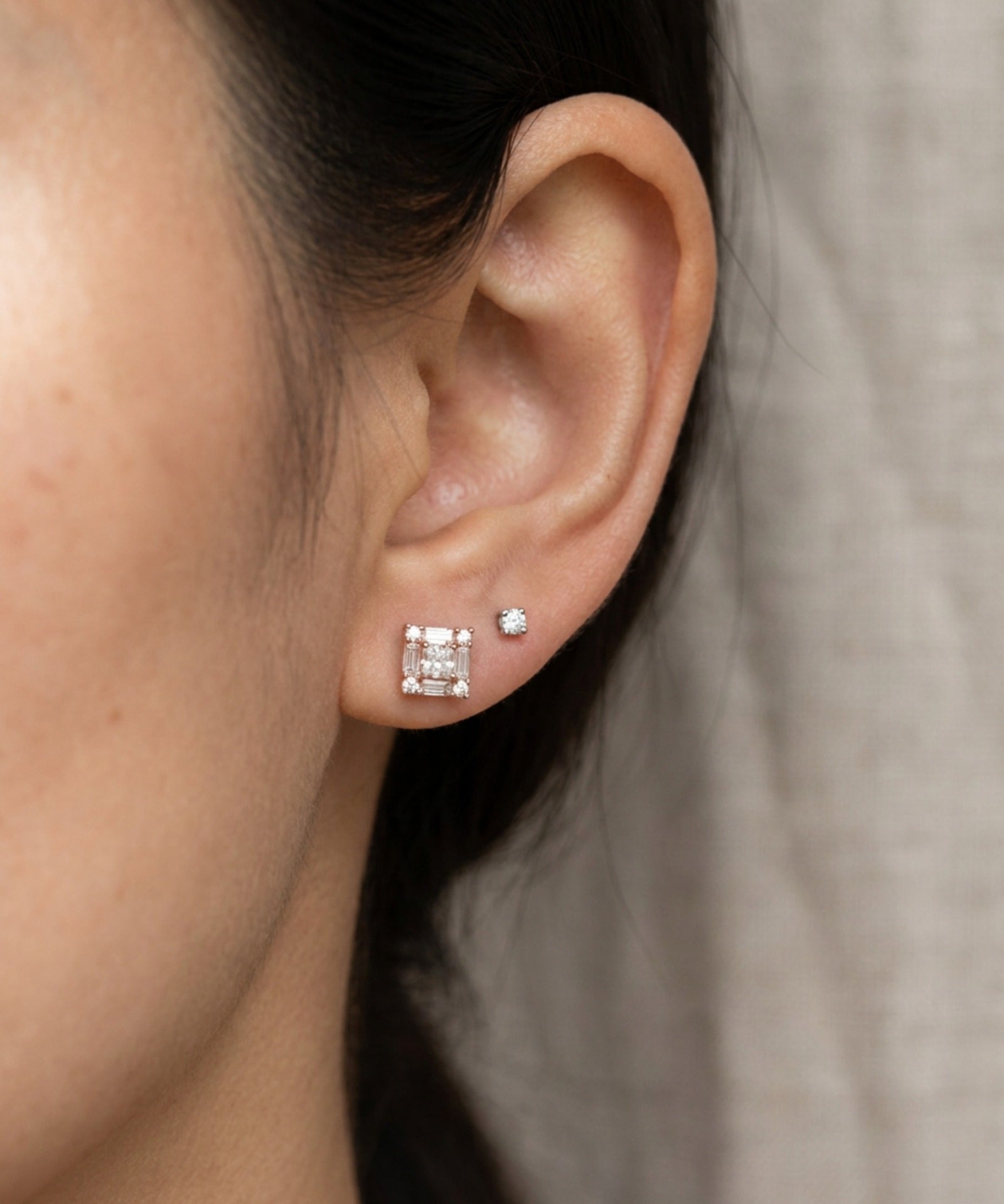 Ear stack featuring 18k rose gold Petite Princess Mosaic Moissanite Stud paired with a small round solitaire stud.
