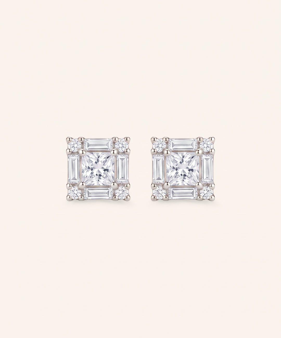 Pair of Petite Princess Mosaic Moissanite Stud Earrings in sterling silver with princess-cut center stone.