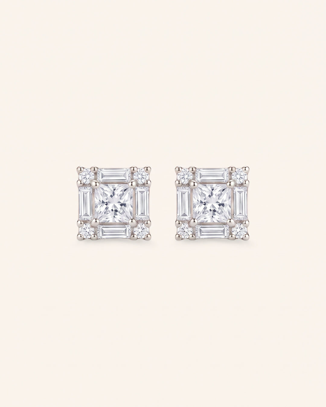 Pair of Petite Princess Mosaic Moissanite Stud Earrings in sterling silver with princess-cut center stone.