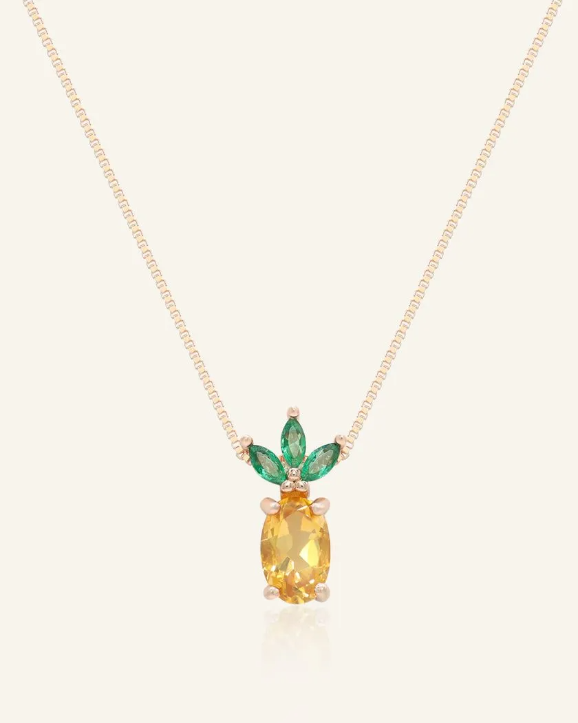 Rose gold pineapple citrine necklace featuring a vibrant oval-cut citrine gemstone as the centerpiece, accented with marquise-cut green cubic zirconias forming the crown-like leaves.