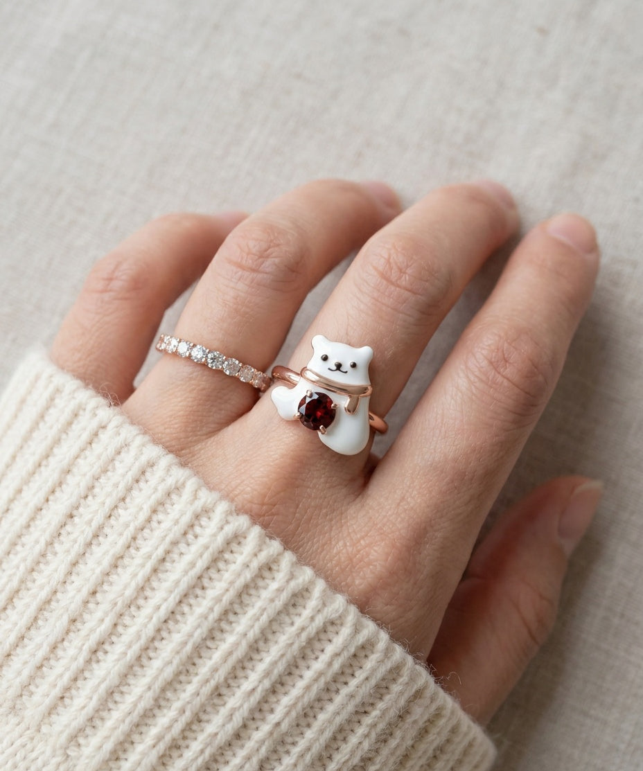 Polar Bear Garnet Ring in rose gold, worn on a model