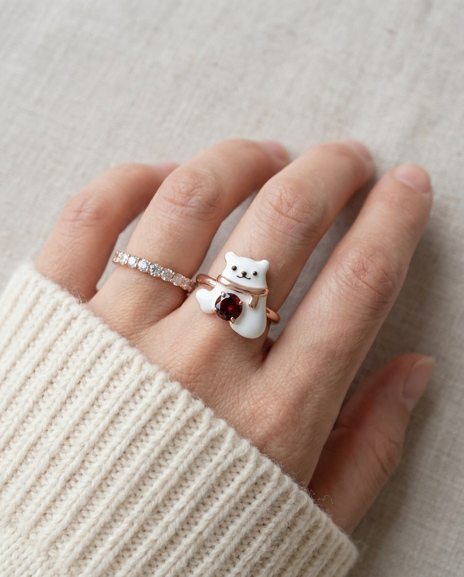 Polar Bear Garnet Ring in rose gold, worn on a model