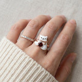 Polar Bear Garnet Ring in rose gold, worn on a model