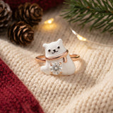 Polar Bear Moissanite Ring in rose gold, laid flat on a tabletop