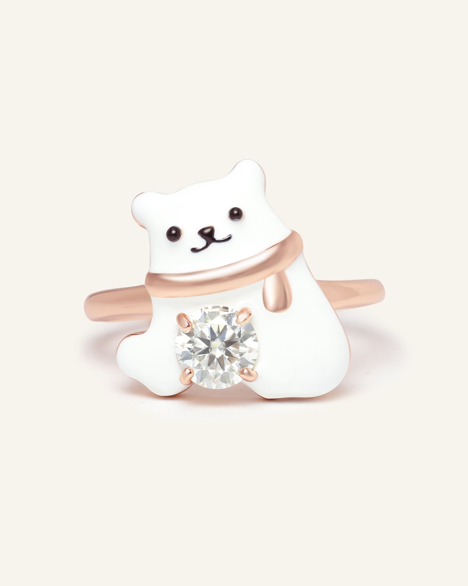 Close-up of the Polar Bear Moissanite Ring in rose gold, resting on a warm linen background
