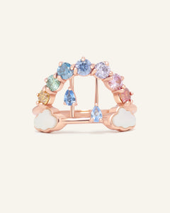 Close-up of the Rainbow's Promise Ring | Moissanite in rose gold, resting on a warm linen background