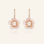 Rose gold sakura hook earrings featuring hand-carved rose quartz petals and a luminous freshwater pearl centerpiece.