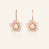 Rose gold sakura hook earrings featuring hand-carved rose quartz petals and a luminous freshwater pearl centerpiece.