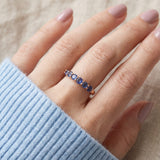 Sapphire Half Eternity Band in rose gold, worn on a model