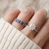Sapphire Half Eternity Band in silver, worn on a model