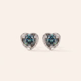 Pair of Sculpted Heart Nest Moissanite Stud Earrings in sterling silver featuring round Celestial Teal moissanite center stones.