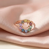 Smiley Ring | Moissanite in rose gold, laid flat on a tabletop