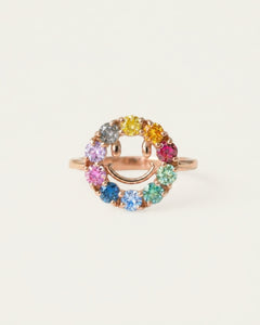 Close-up of the Smiley Ring | Moissanite in rose gold, resting on a warm linen background