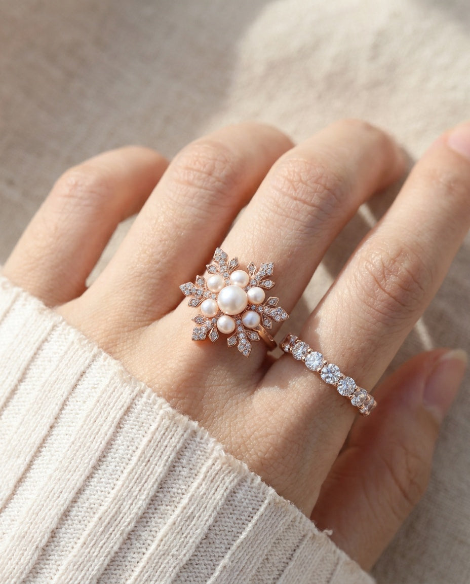 Snowflake Pearl Halo Ring in rose gold, worn on a model