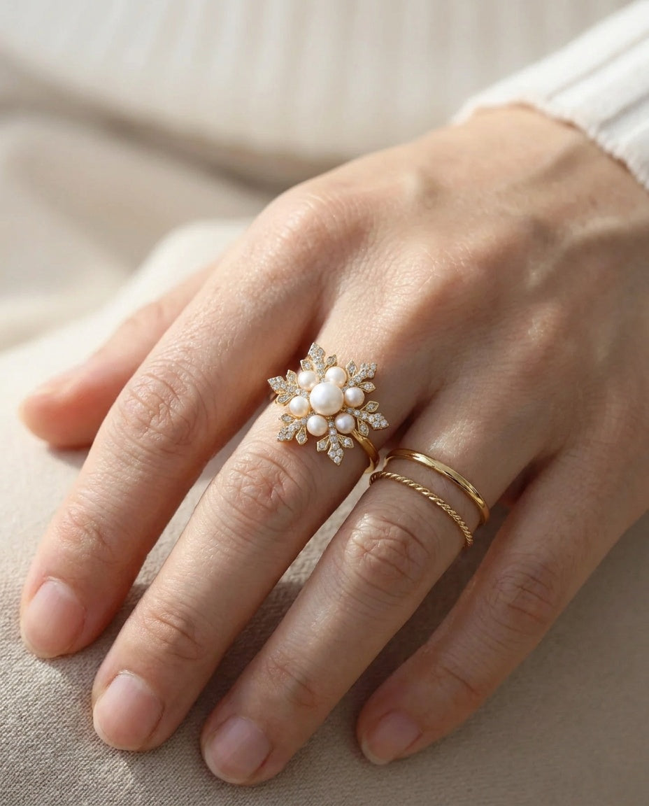 Snowflake Pearl Halo Ring in yellow gold, worn on a model