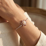 Snowflake Pearl Tennis Bracelet in rose gold, worn on a model