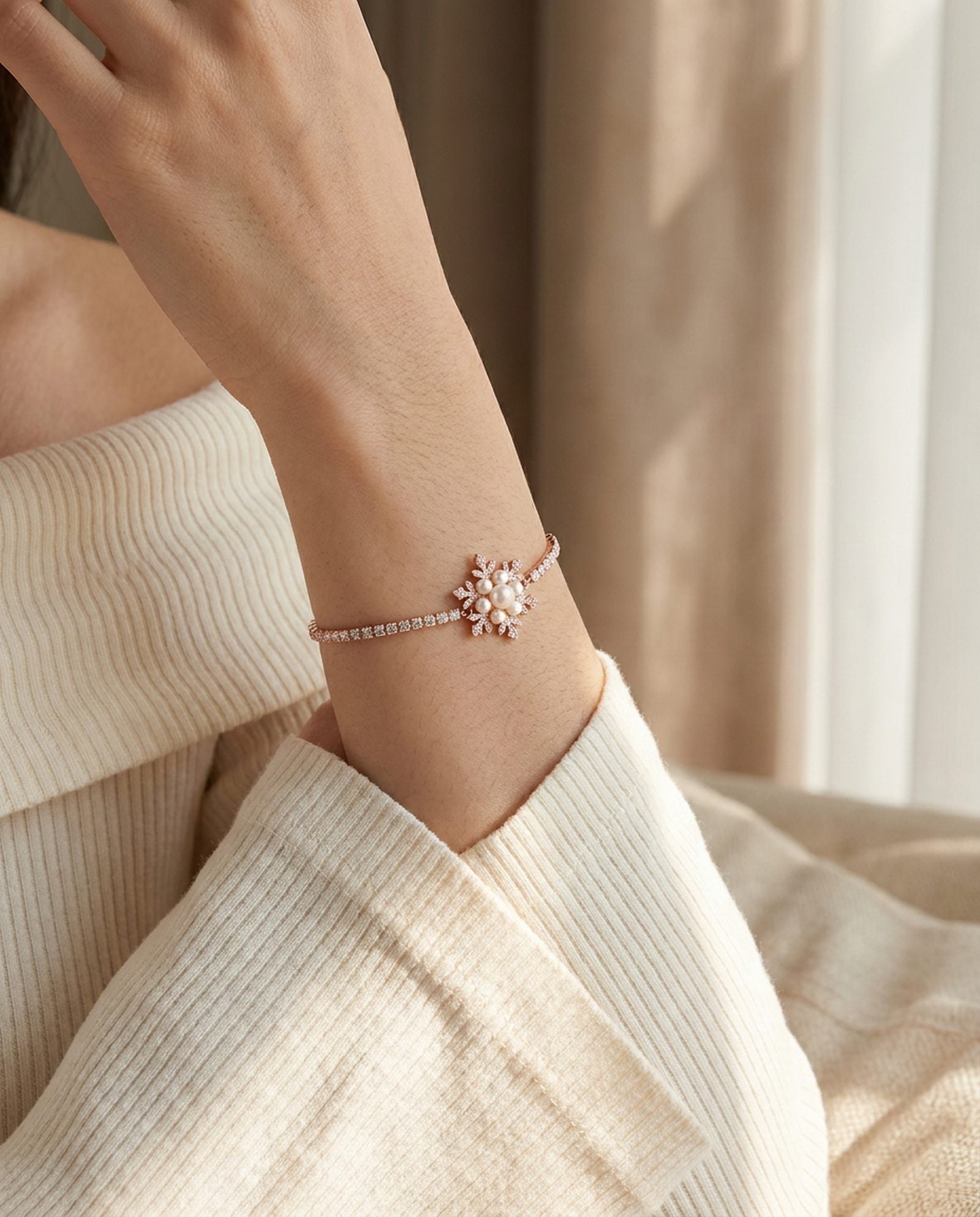 Snowflake Pearl Tennis Bracelet in rose gold, worn on a model