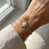 Snowflake Pearl Tennis Bracelet in yellow gold, worn on a model