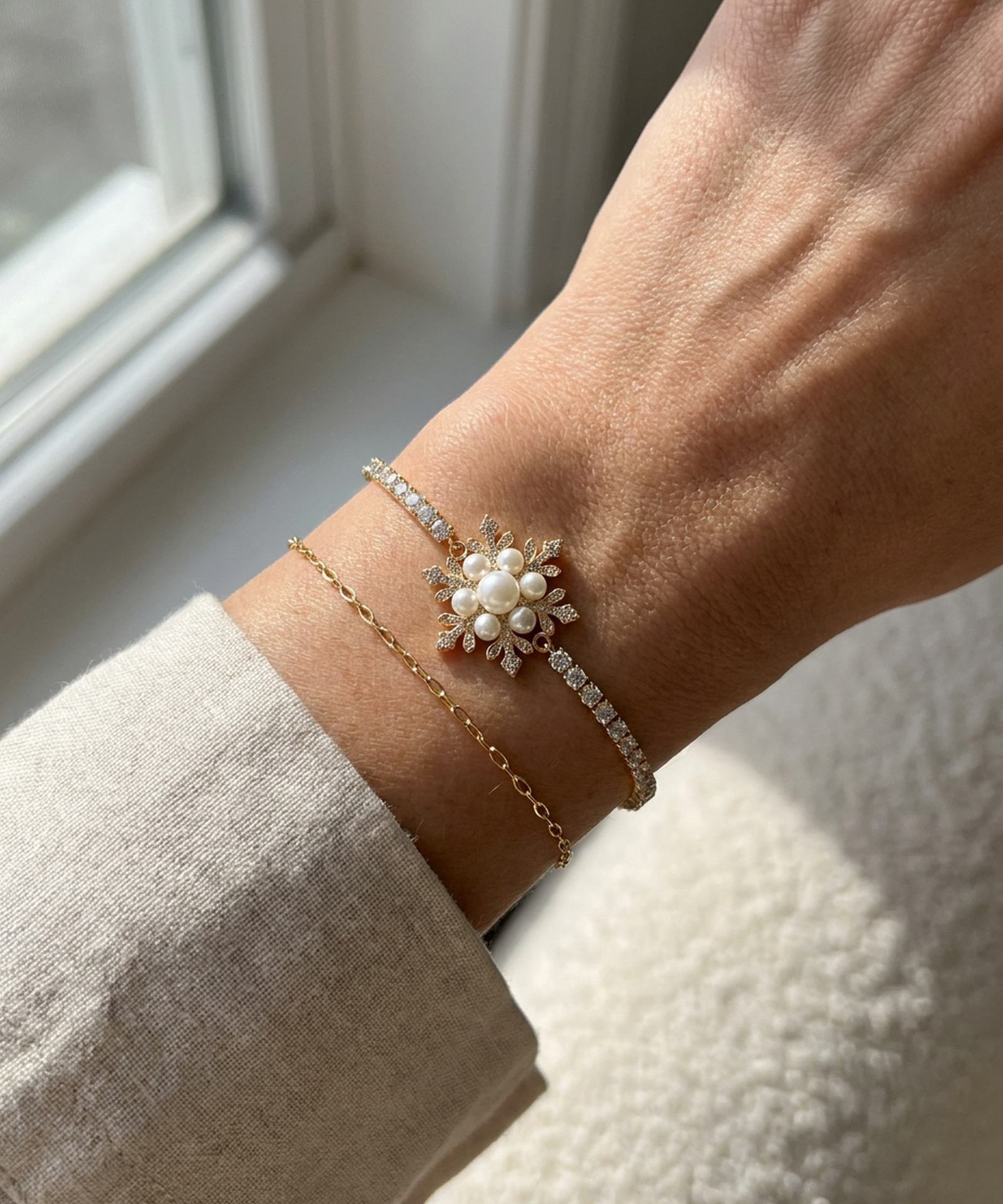 Snowflake Pearl Tennis Bracelet in yellow gold, worn on a model