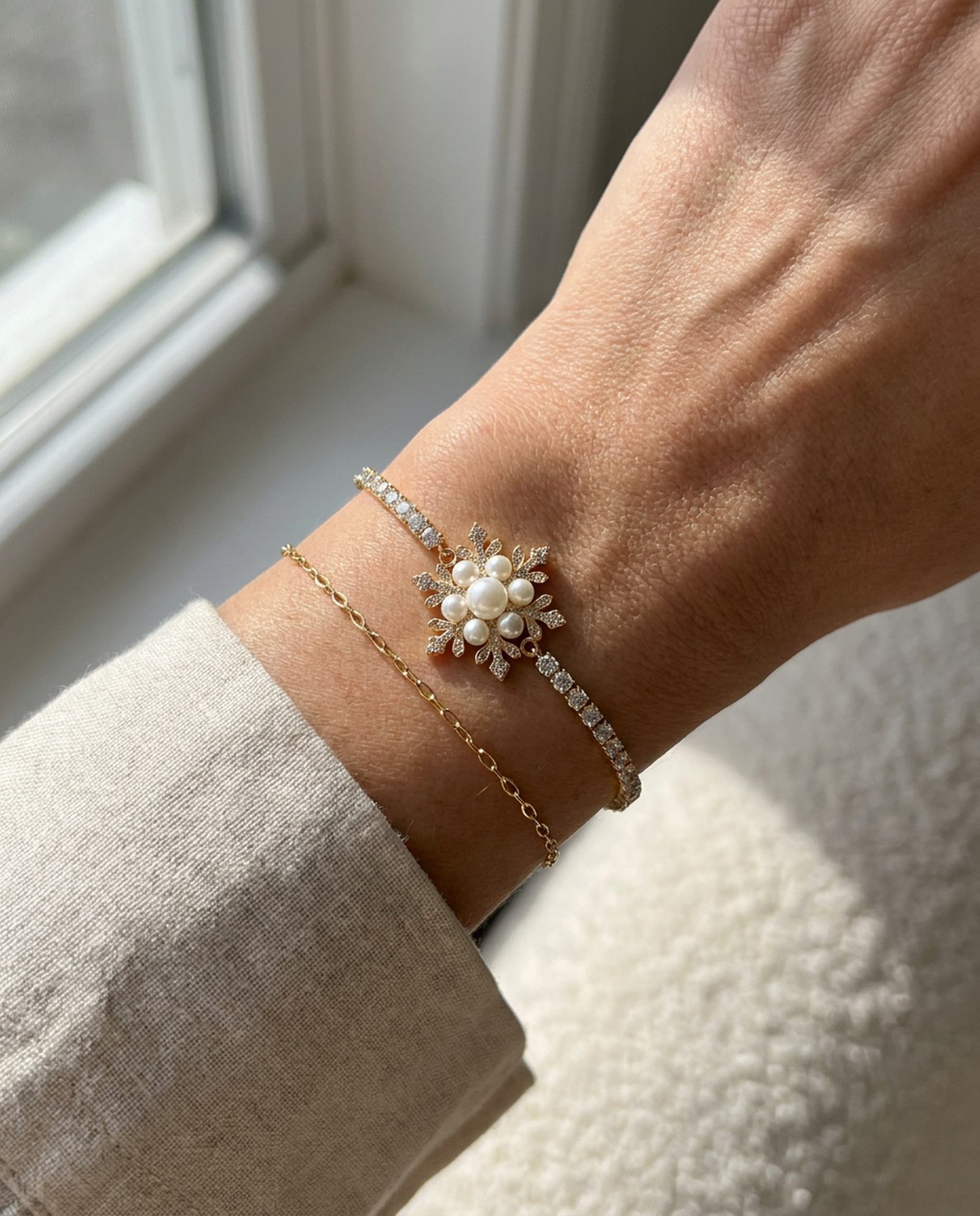 Snowflake Pearl Tennis Bracelet in yellow gold, worn on a model