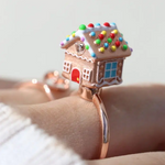 A Model wearSpinning Gingerbread House Ring Rose Gold