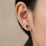 Ear stack featuring sterling silver Starlight Crown Crescent Moissanite Stud in Celestial Teal paired with a plain silver huggie hoop.