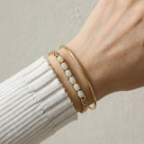 Watch Chain Opal Bracelet laid flat on a tabletop, alternate angle