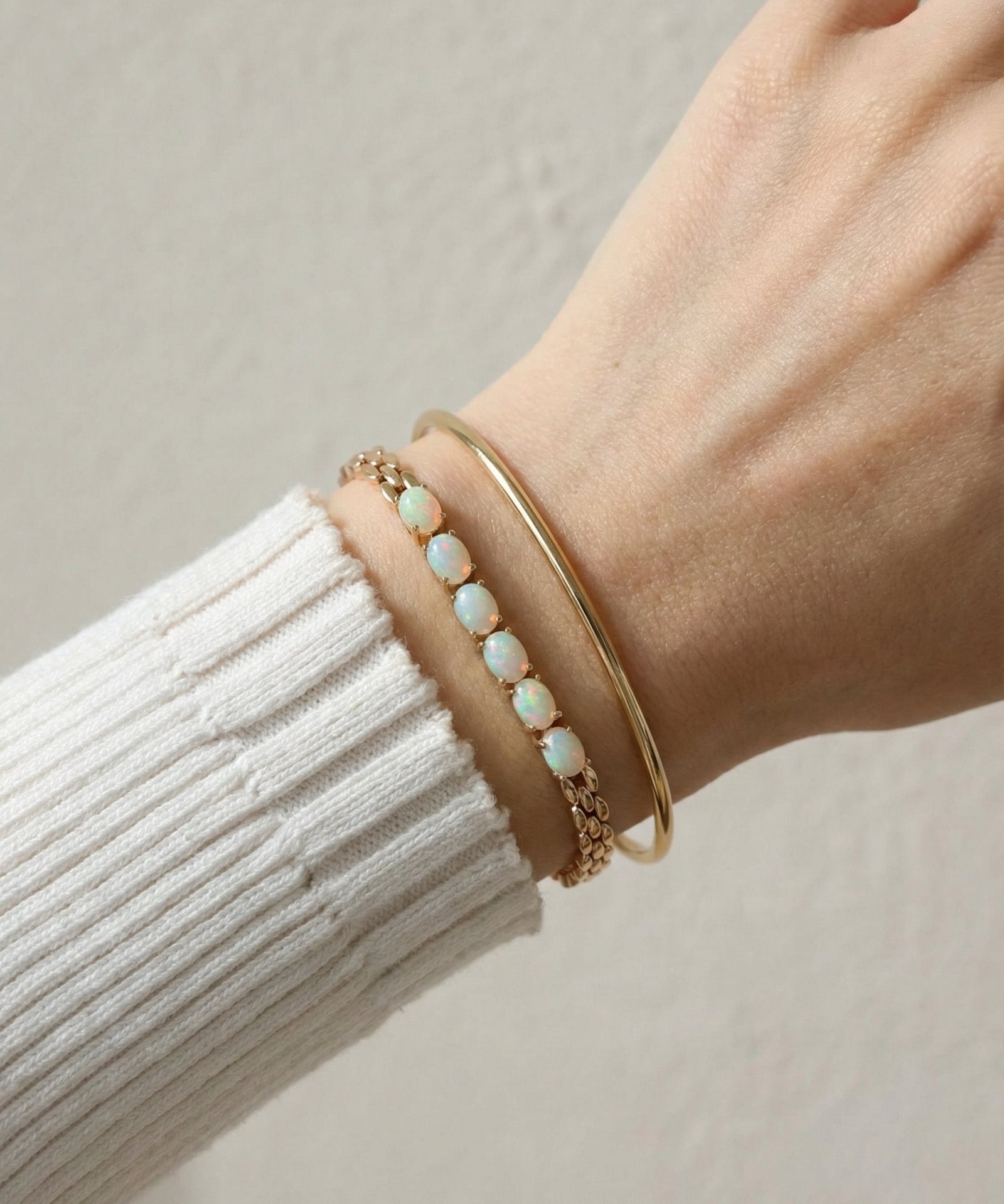 Watch Chain Opal Bracelet laid flat on a tabletop, alternate angle