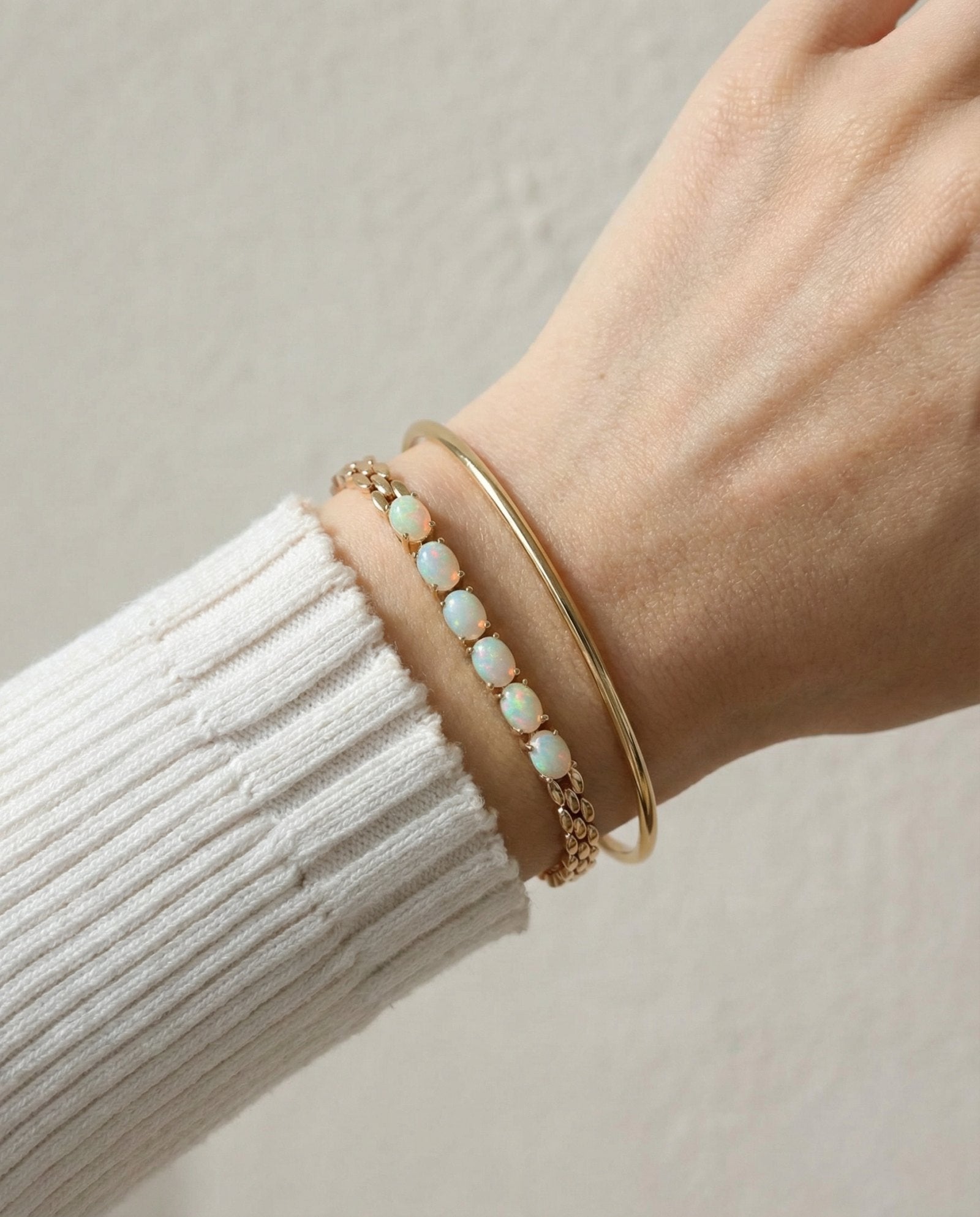 Watch Chain Opal Bracelet laid flat on a tabletop, alternate angle