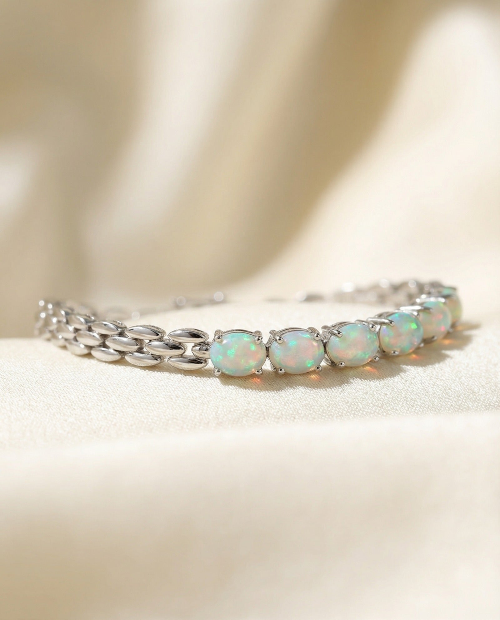 Watch Chain Opal Bracelet laid flat on a tabletop, close-up on the link detail