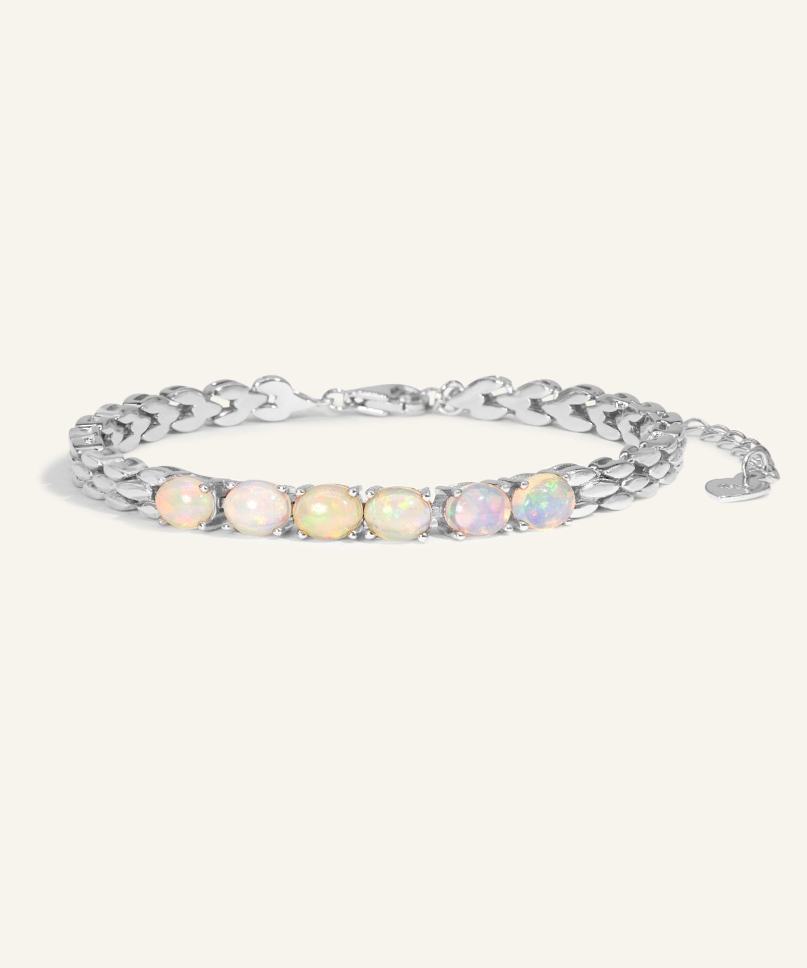 Watch Chain Opal Bracelet laid flat on a tabletop, side angle