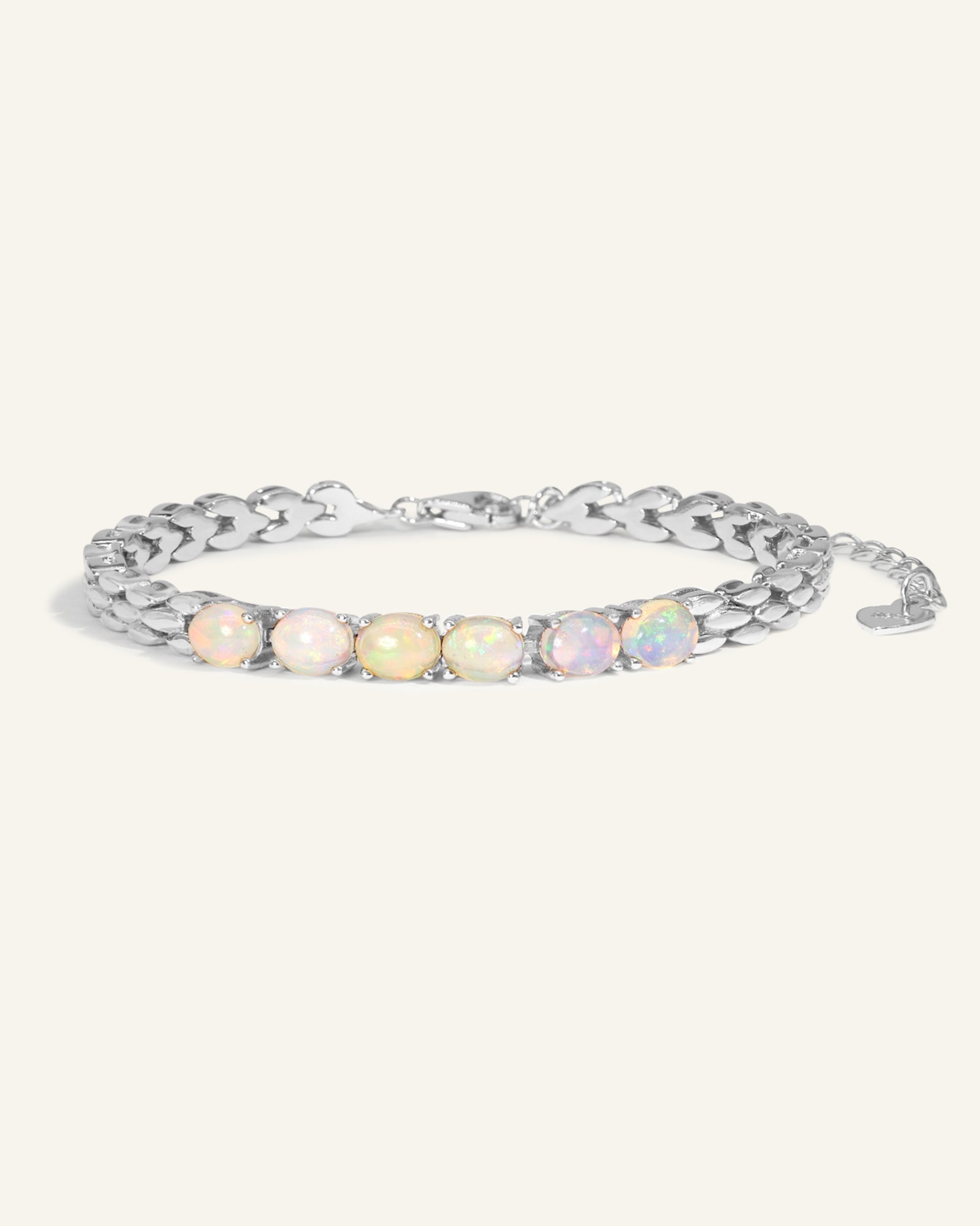 Watch Chain Opal Bracelet laid flat on a tabletop, side angle